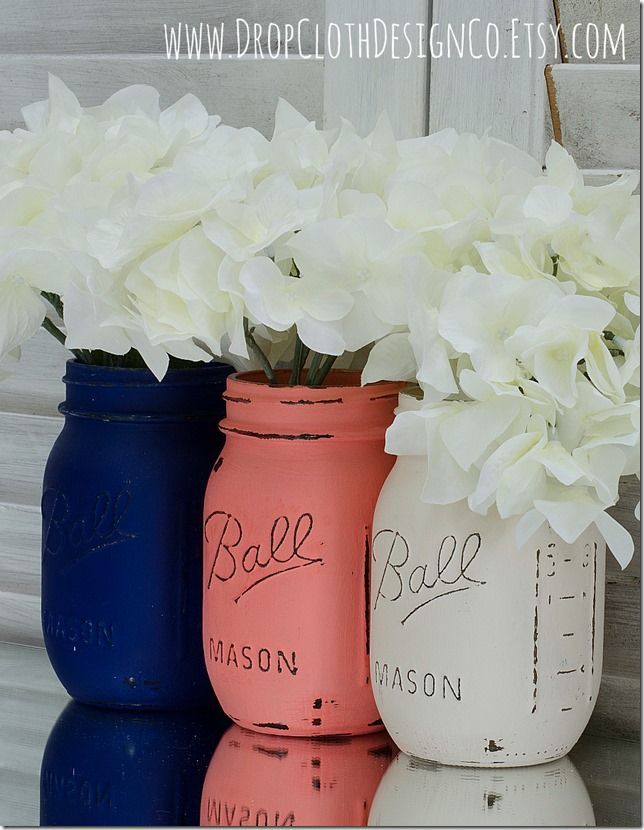 Navy, Coral, Cream Painted and Distressed Mason Jars..I would do white silver and red for my room