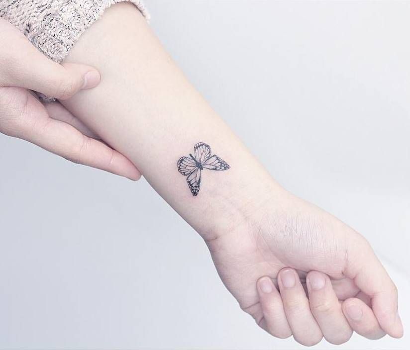 Small butterfly tattoo on the left inner wrist. Tattoo artist: Mini Lau