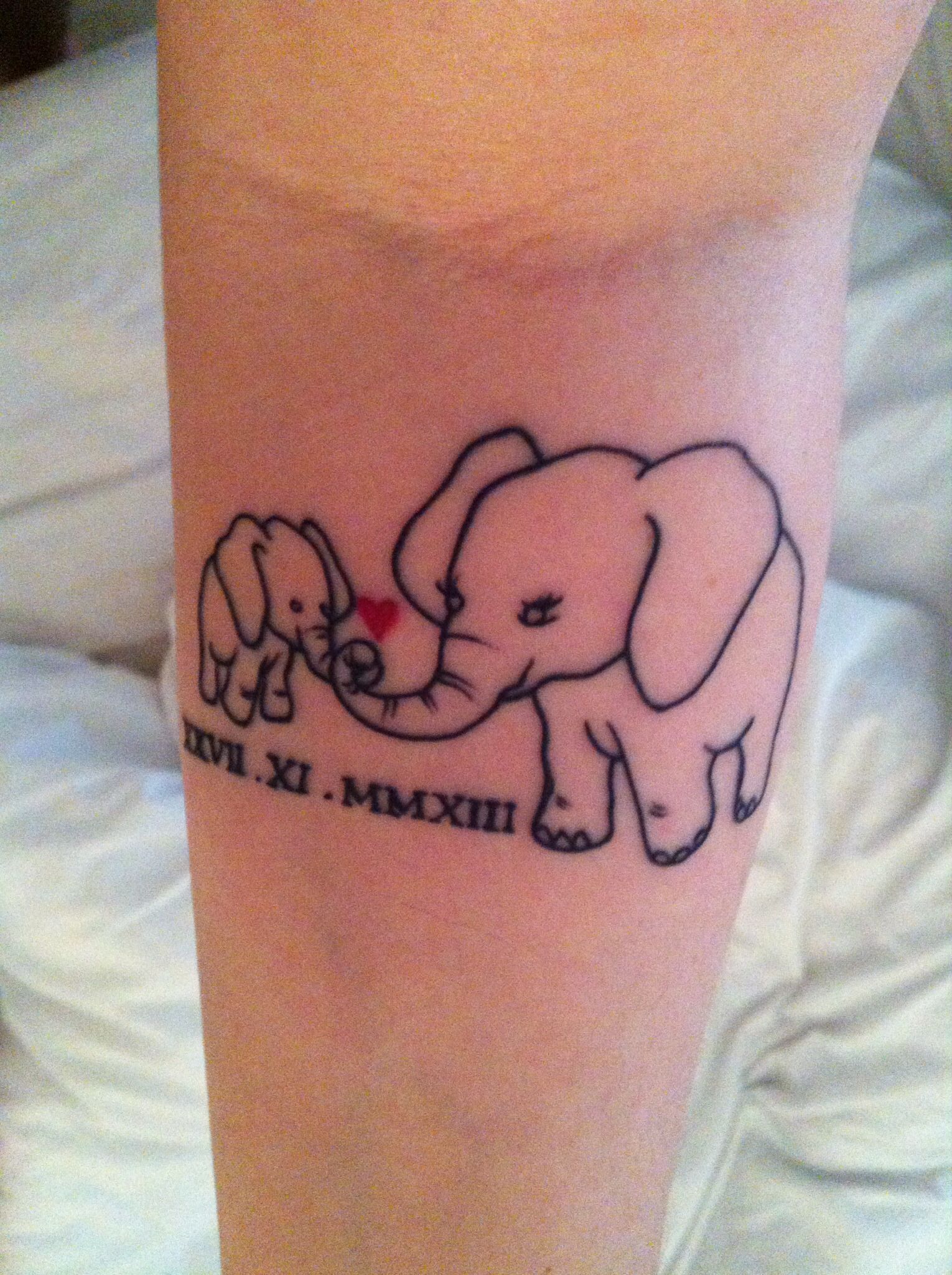 thanks to Chris Hatton in Physical Graffiti Cardiff for putting my tattoo idea into reality – mummy & baby elephant with red heart