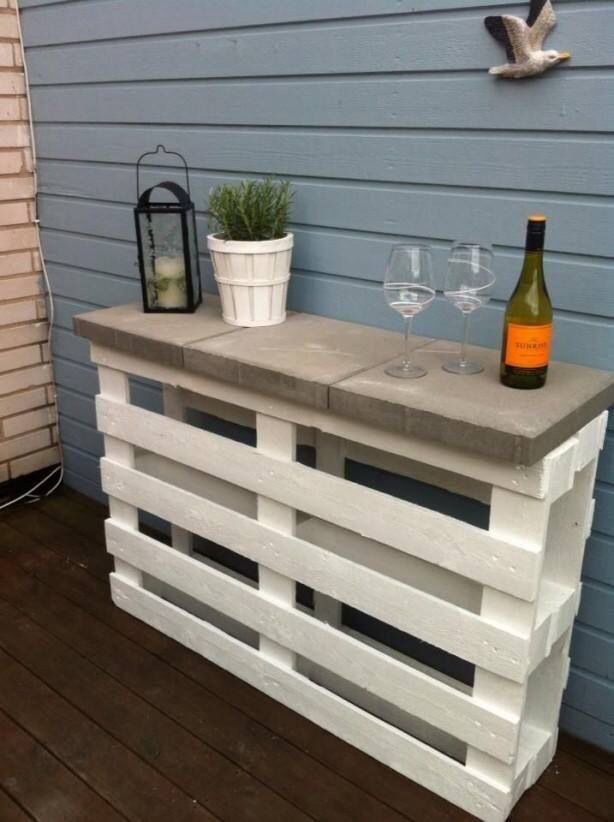 The simplistic use of cement tiles & pallets, combined with a coat of paint is ingenious. This outdoor bar / sideboard is perfect