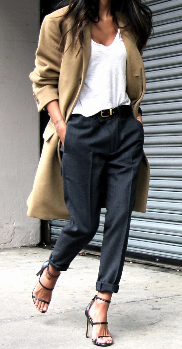 This entire outfit is built around neutral staples, like a white tee shirt, tailored pants and classic trench coat.  Oversized