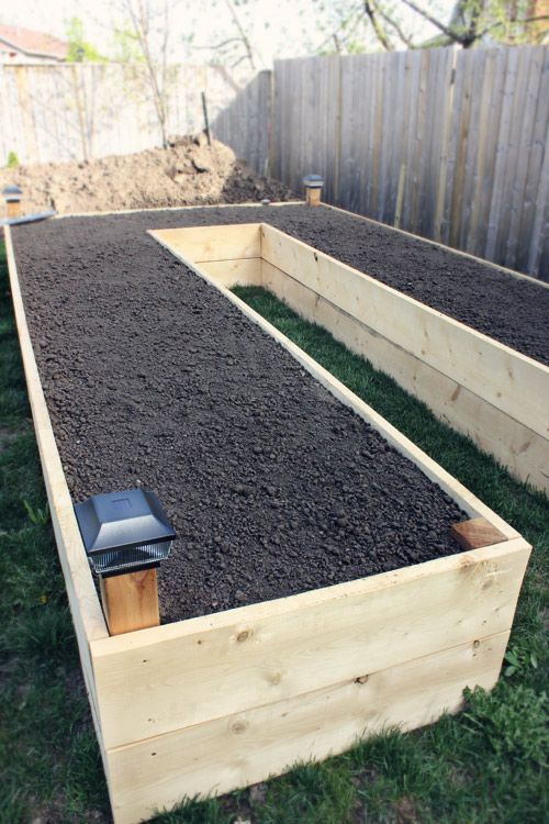 This is a raised bed garden idea that gives you walking space to water all of the plants. So smart!