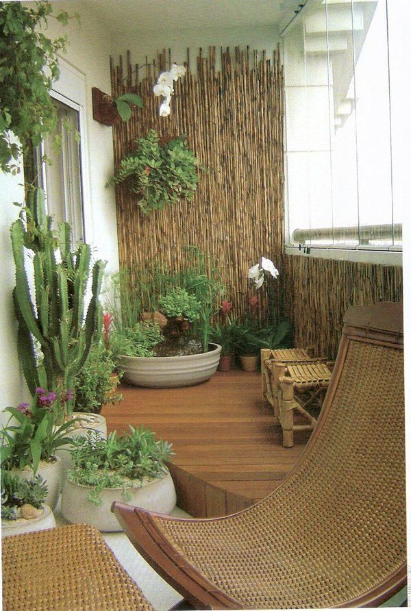 Transform your balcony into a mini garden. You can do this with help from an array of potted plants, wooden chairs and bamboo