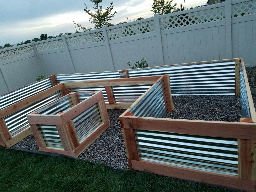 Used redwood and galvanized sheet metal. Measures 4 ft W x 8 ft x 16 ft x 27 in H. – Fresh Gardening Ideas