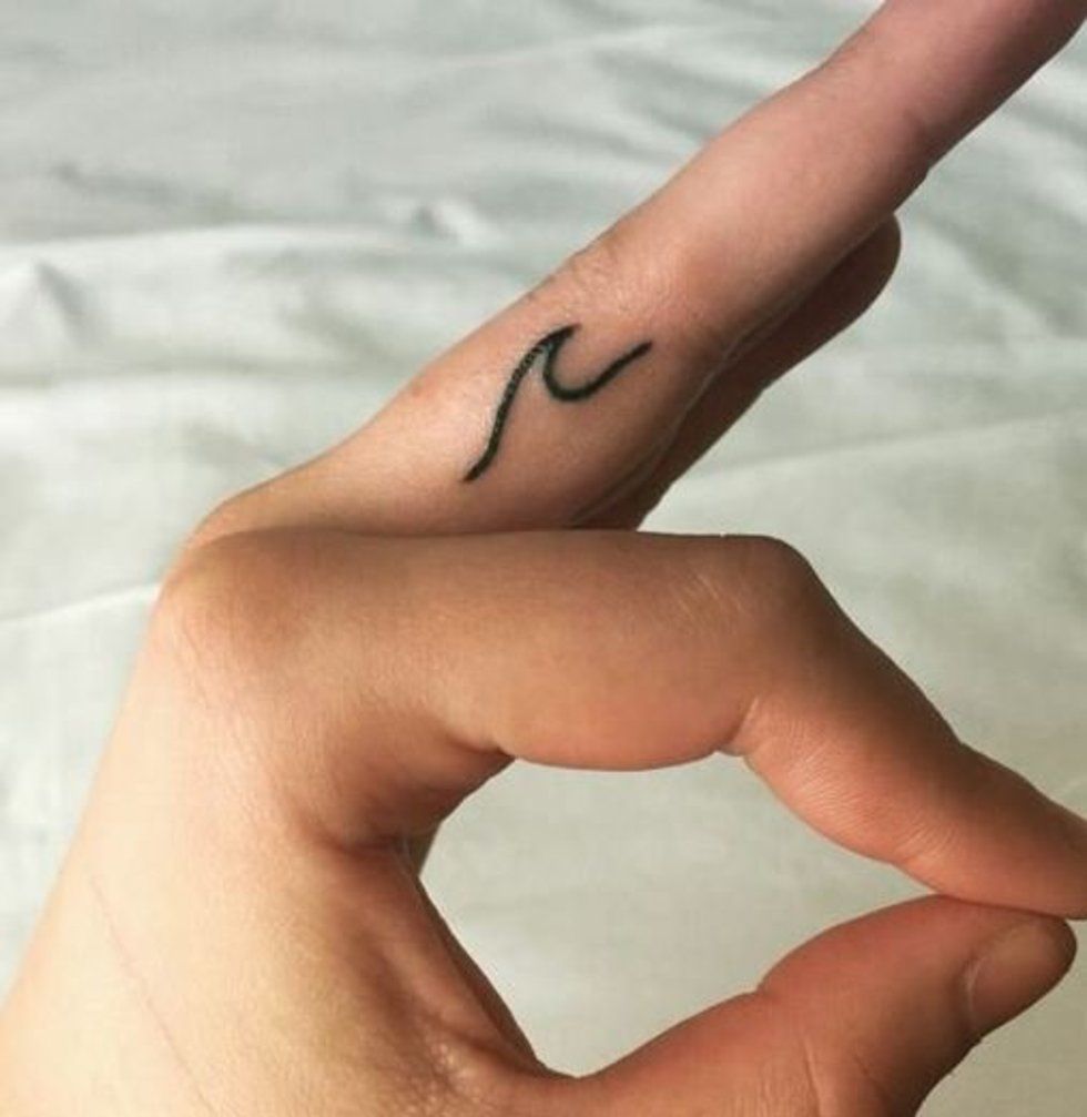 50 delicate and tiny finger tattoos to inspire your first (or next) body art