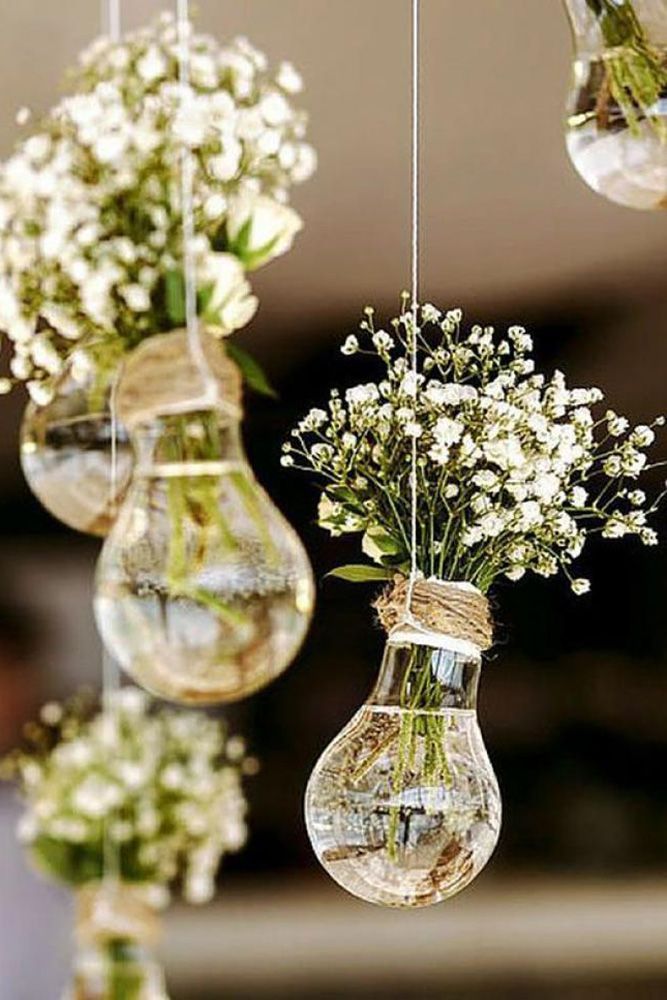 budget rustic wedding decorations flowers gypsophila in vases similar to light bulbs suspended on a rope colin cowie weddings