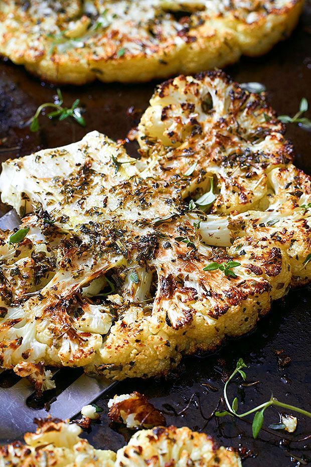 Few ingredients, big payoff! These cauliflower steaks are brushed with a mixture of olive oil and italian herbs, then roasted in