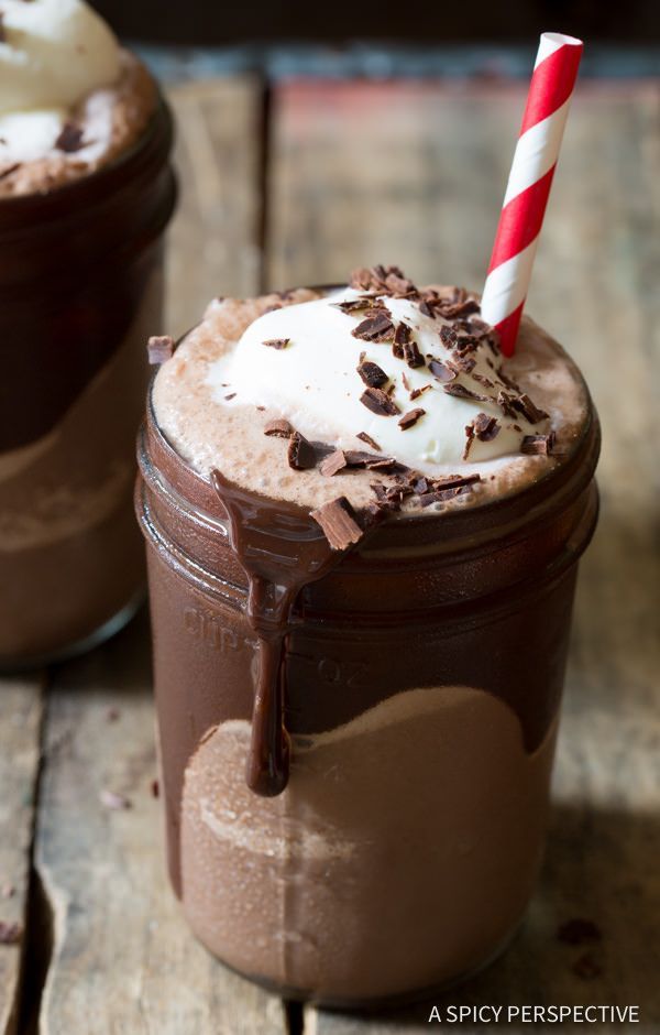 Frozen Hot Chocolate Recipe – A cool creamy blend of sweet chocolate and milk, topped with whipped cream and chocolate shavings.