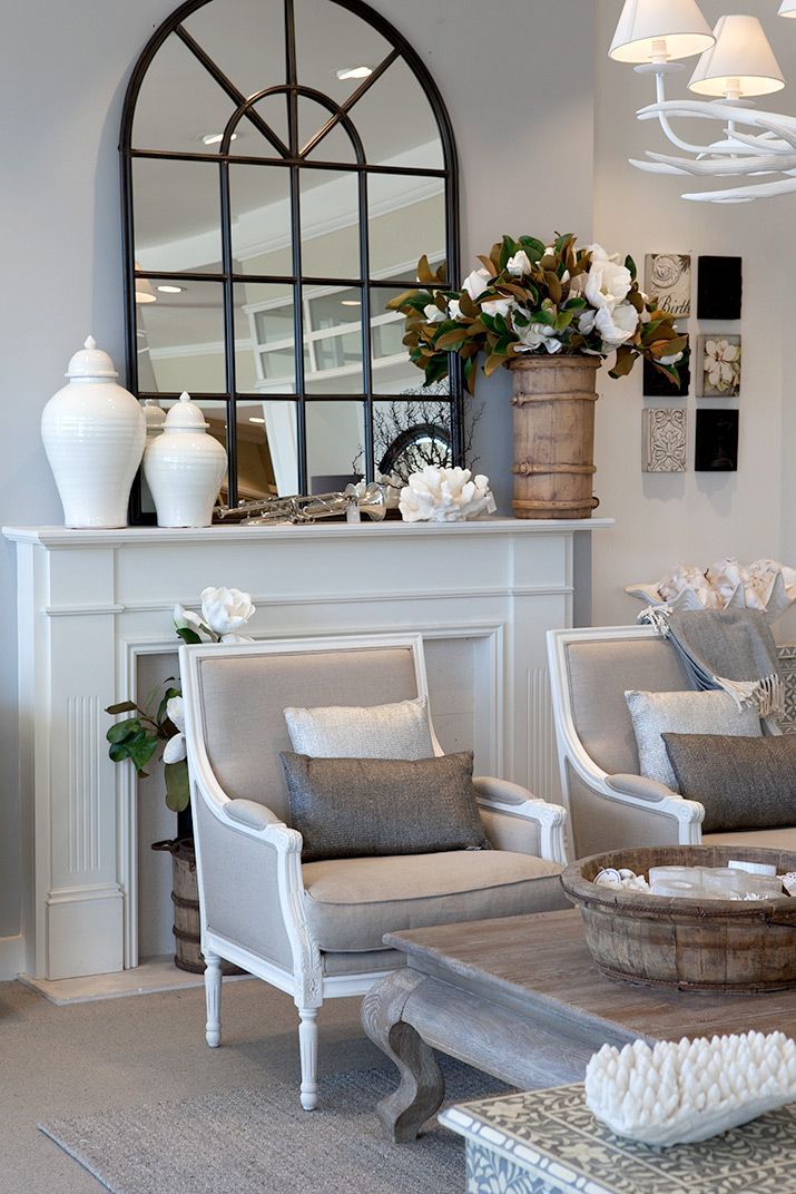 Linen chairs in front on white mantle.