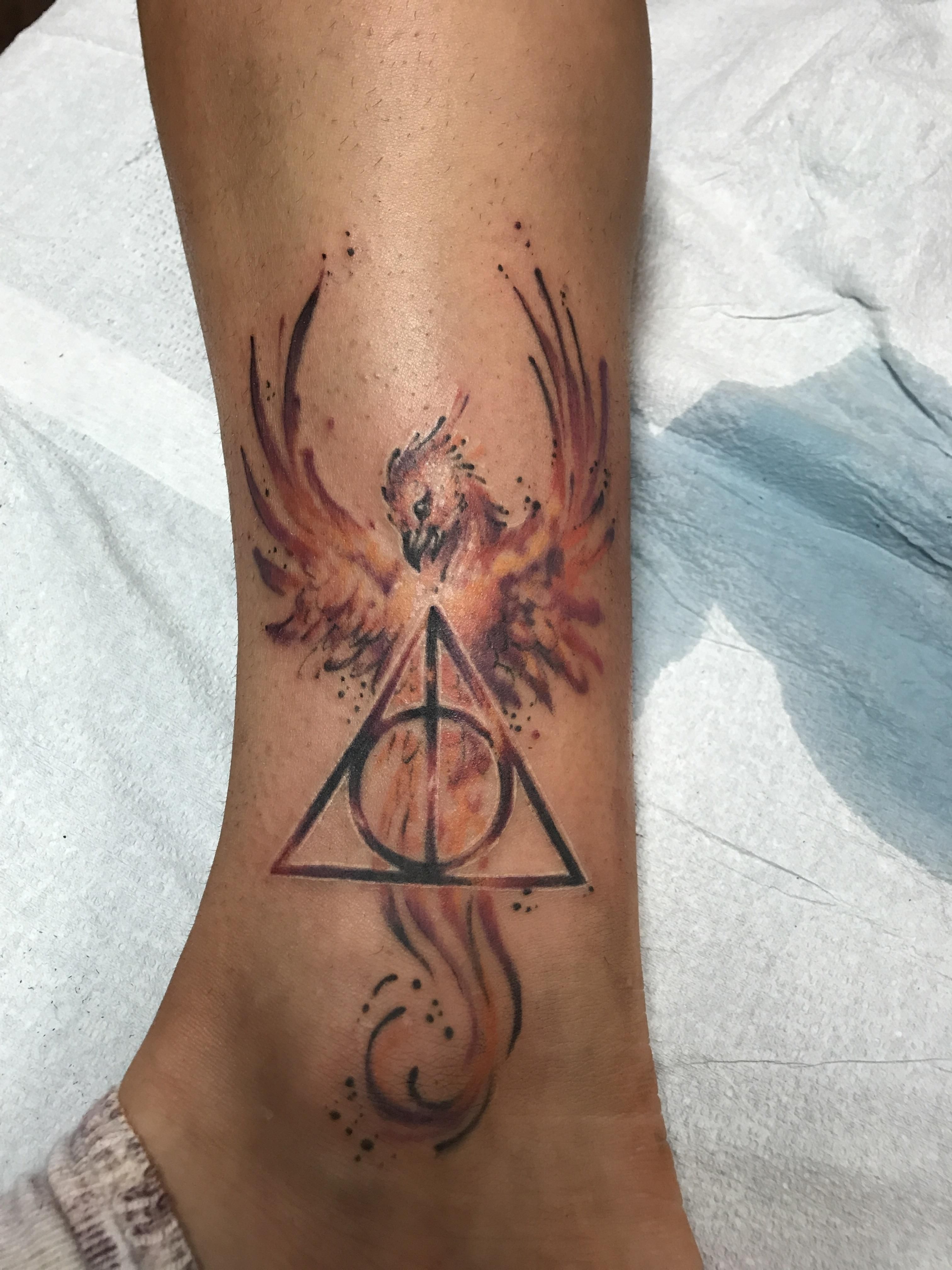 This Harry Potter Tattoo my girlfriend got today. Tattoo by Invidia Tattoo in Asheville. Artist: Mike McFarlande