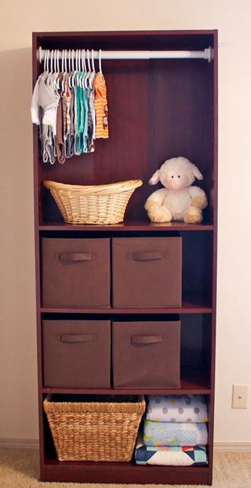 Turn a bookshelf into a mini-closet for the baby’s room.