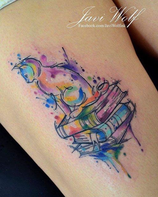 watercolor cat on books tattoo