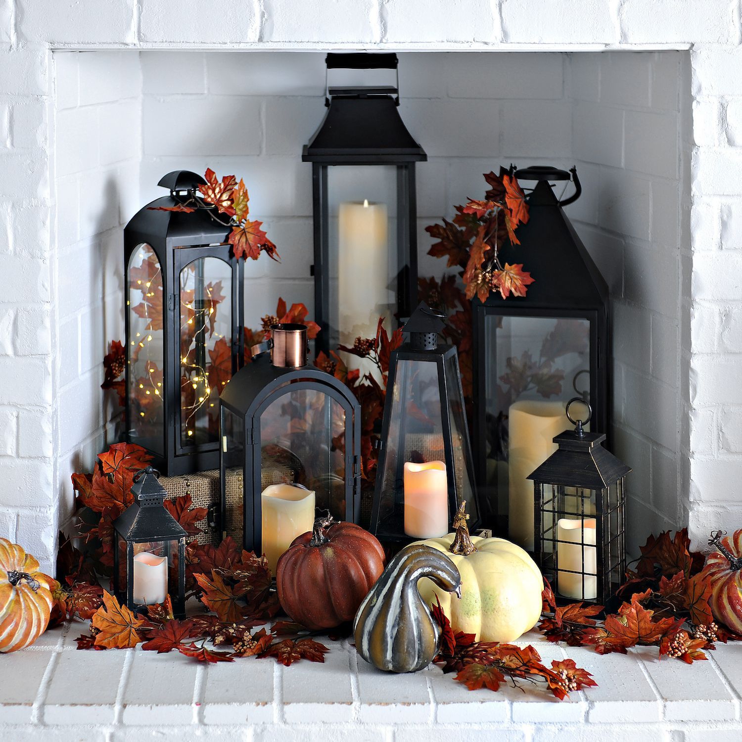 Use your fireplace as another space in your home to decorate for fall! Fill it with an array of lanterns and create a statement. You can also fill the lanterns with string lights, candles or leaves for a fall look! -   24 apartment fireplace decor ideas