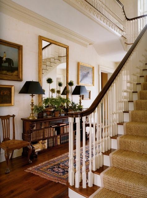 Love this foyer.  Texture on stairs with older Persian rug.  Plants. -   25 antique decor traditional
 ideas