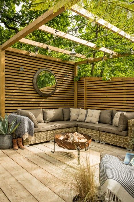Bordering the New Forest in the idyllic Lymore Valley, this industrial-inspired retreat comes complete with a huge lawn for morning yoga, hot tub, fire pit and his'n'hers cruiser bikes for peddling down to the beach. A bubble of country dreams you'll never want to burst! -   25 garden decking inspiration
 ideas