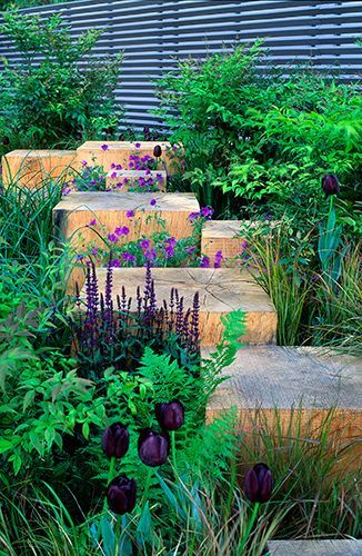 great! Love the wood blocks in between a flower bed serving as steps and as kind of wooden sculptors. I wonder if I can do this with some fallen wood.. -   22 modern garden slope ideas