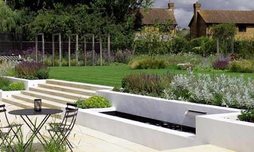 Barn Conversion Contemporary Family #Garden. By London garden designer Cassandra Crouch. This large garden in Hertfordshire sits to the rear of a modern barn conversion owned by a young family. -   22 modern garden slope ideas