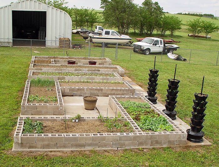 Ok, this is kind of cute. and it would be easy. rail road ties for raised beds - cinder blocks release a bad chemical. You have to use unteated railroad ties. -   24 cinder block garden beds
 ideas
