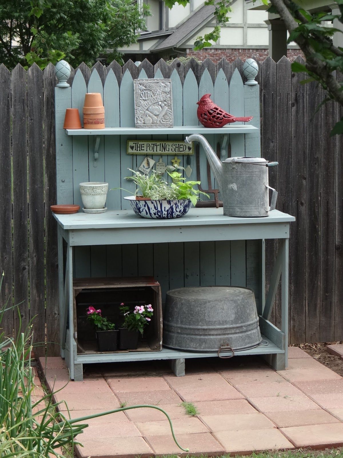 ... realistic suburban garden, I spied this potting bench, painted just the right shade of blue to offset the terracotta accents and galvanized what-nots. -   24 zen garden bench
 ideas