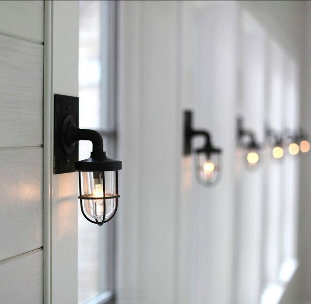 The hallway that leads to the bedrooms carry beautiful nautical sconces from “Marsten and Langinger” (UK). - Classic Shingle Beach Cottage with Neutral Interiors -   25 industrial beach decor
 ideas