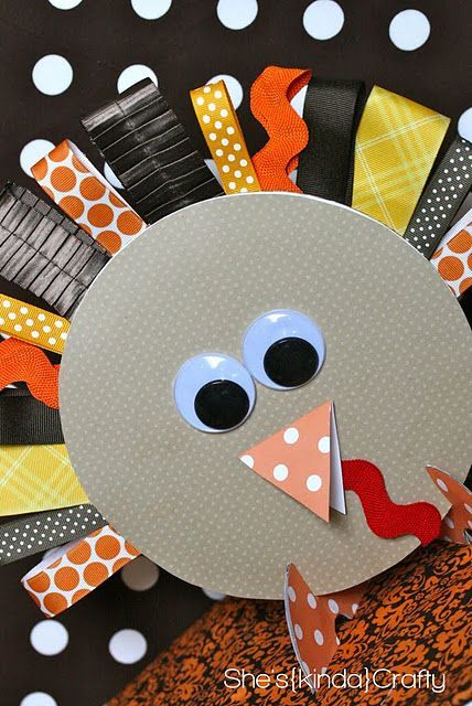 Turkey made out of ribbon loops (with a piece of floral wire to hold up) for feathers, googly eyes, scrapbook paper beak, and cardboard circle with cute paper to cover for body. -   25 ribbon crafts thanksgiving
 ideas