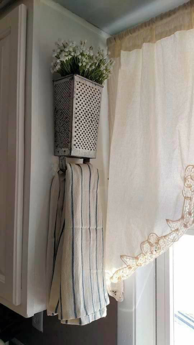 Vintage grater - re-purposed for towel holder and flower planter. Great idea for farmhouse kitchen decor. -   22 shabby farmhouse decor
 ideas
