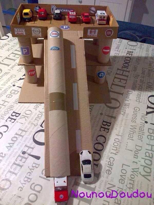 DIY cardboard garage toy to make for boys from box and cardboard tubes. -   24 cardboard crafts for boys
 ideas