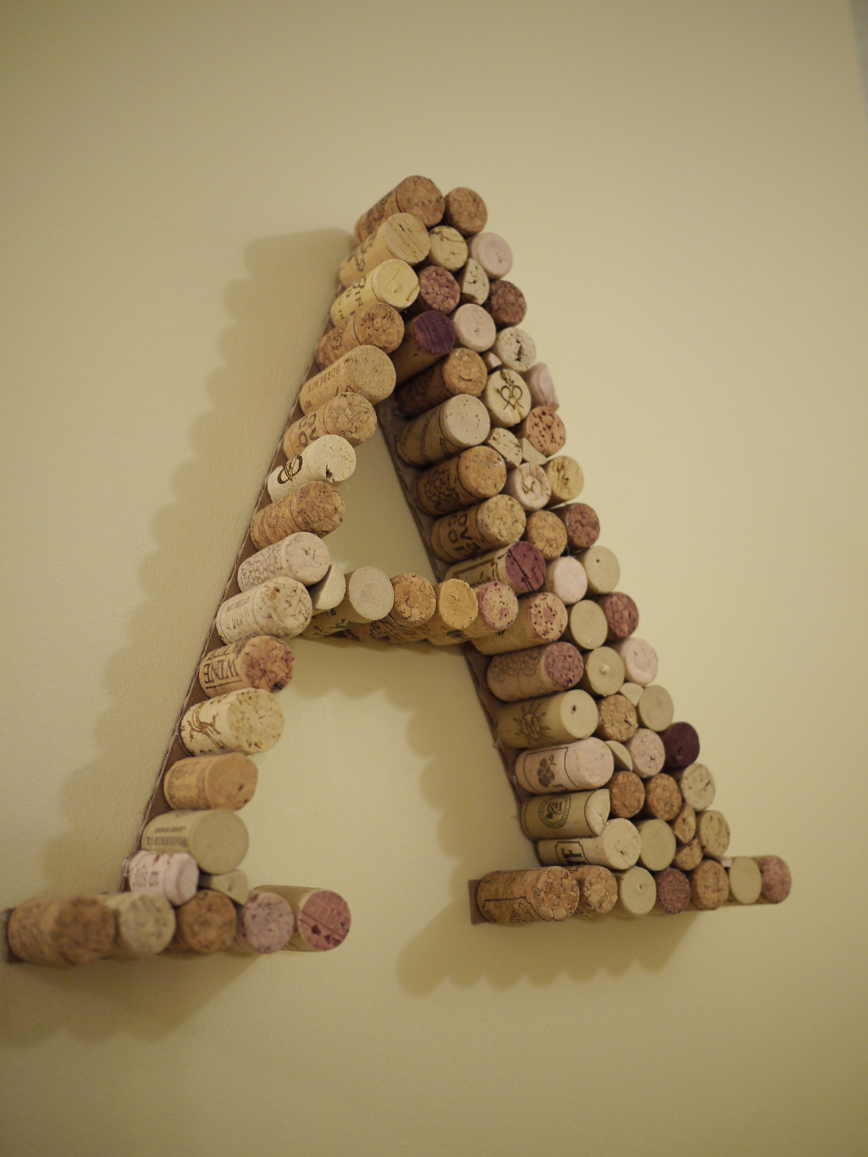 Wine Cork Initial..... If I could only find the wine cork that my aunt nearly shot through my ceiling!!!  LOL -   24 cork crafts initials
 ideas