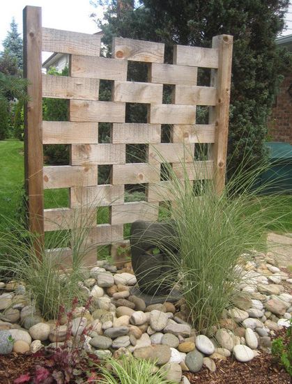 a litle bit of privacy with an artistic flare -   24 rock garden fence
 ideas
