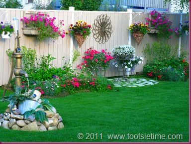 decorating a garden fence, love this idea very much!  wall art, birdhouses, etc...don't know if I could keep that many flowers alive but I could try! -   24 rock garden fence
 ideas