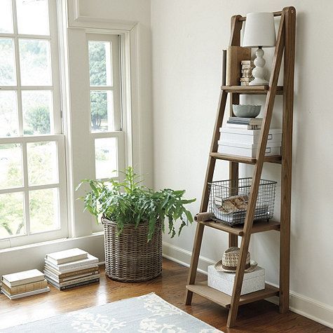 I would like a leaning bookshelf like this for between the front door and picture window. -   25 tall shelf decor
 ideas