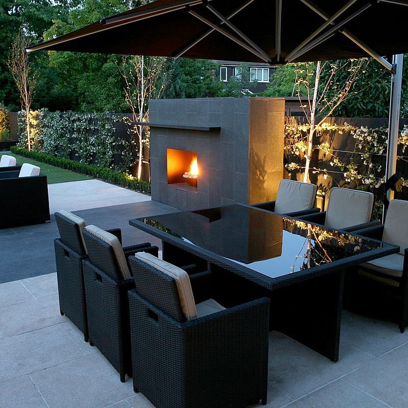 Contemporary Garden. Love this outdoor fireplace! Would like the seating closer to it to take advantage of the warmth. -   22 modern garden furniture
 ideas