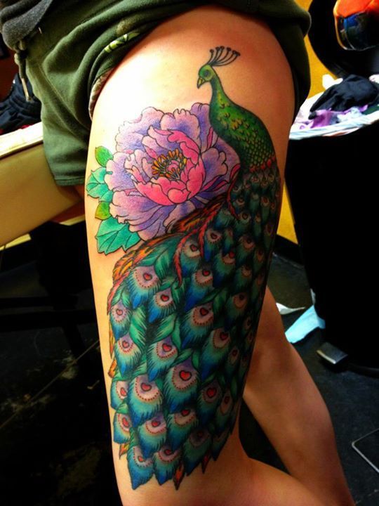 Peacock thigh piece.  This is exactly how/where I want mine, minus the flowers -   22 peacock thigh tattoo
 ideas