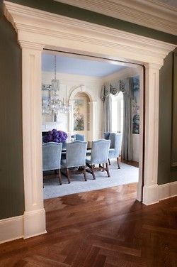 Stunning traditional dining room through a heavily framed double wide archway by Thomas Burak. Love how the green of the hall perfectly enhances the mural in the predominantly blue dining room. -   24 dining decor crown moldings
 ideas