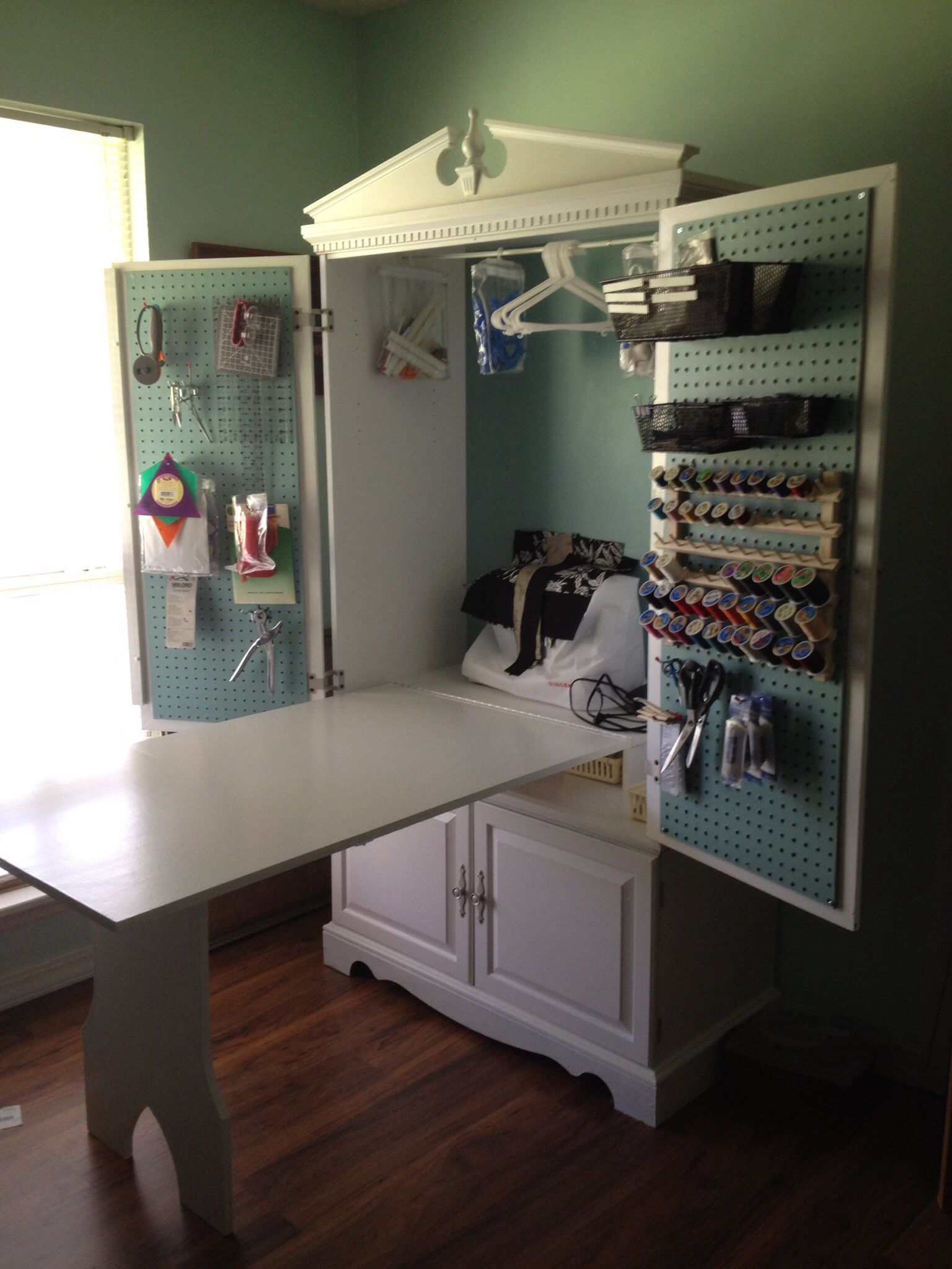 TV Armoire turned into a sewing cabinet with fold up table -   24 folding crafts table
 ideas