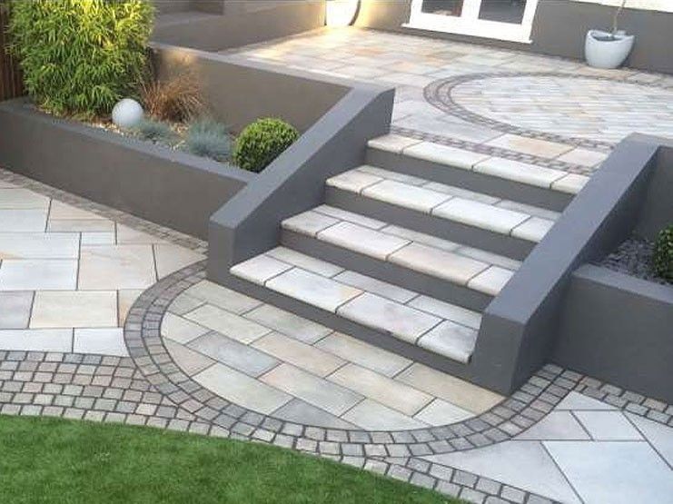 Painted render retaining walls, tiered beds with retaining walls, paving detail at bottom of steps (but straight lines better for us). Also the edging on either side of the path in front of the raised bed is nice. -   24 tiered garden decking
 ideas