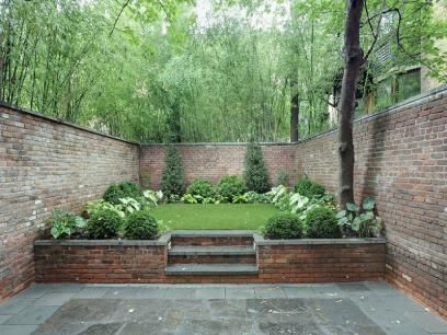 Could add a completely different level on TOP of the concrete yard at one end, for a separate area feeling. Raised planter large enough for anything except trees. Beautiful. -   24 urban garden wall
 ideas