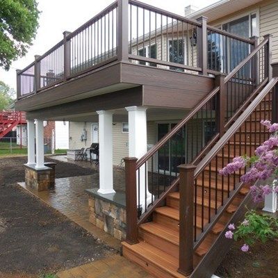 Decks Only Custom Designed and Built 2nd floor deck with dry space underneath and Cambridge ledgstone patio. -   25 upper deck decor
 ideas