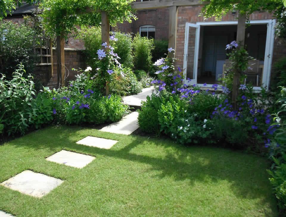 I would LOVE to have our walkway look like this! Quentins been working on the lawn and were relaying the stones soon so heres hoping -   23 small garden lawn
 ideas