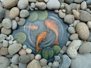 Pond Fish Water Painted on Large Rock Surround by River Rocks to make the illusion even better! Beautiful work  by  Julie Michels -   25 diy rock garden
 ideas