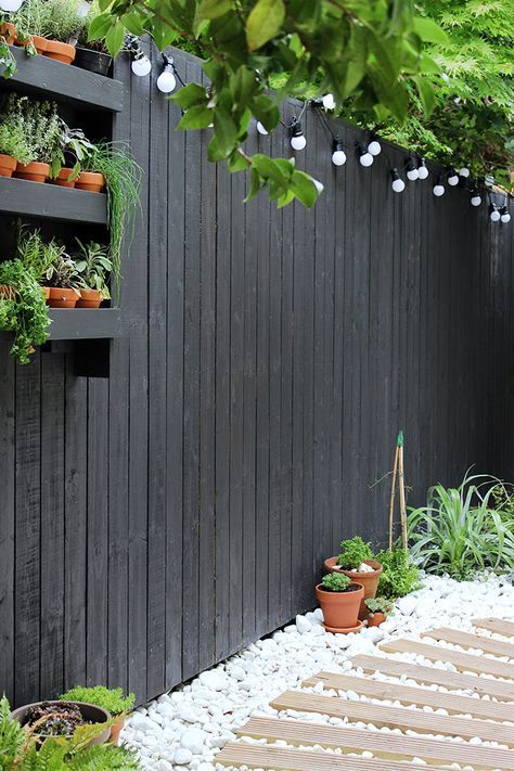 Modern garden makeover -   21 black garden fence
 ideas