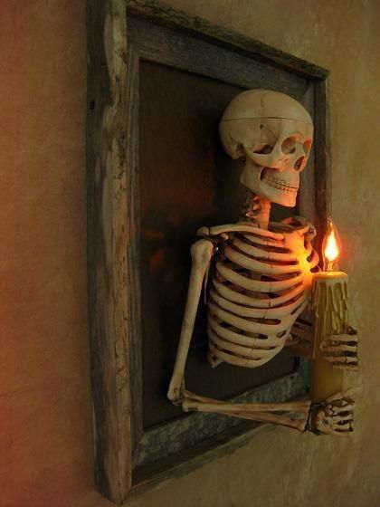 Framed 3D Skeleton Torso holding Candle -   22 boho halloween decor
 ideas