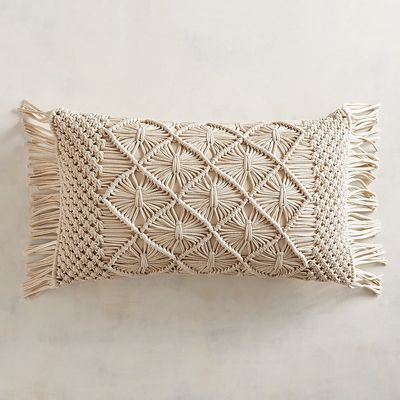 Macrame is back! We’ve given it a gorgeous update with our natural-colored pillow that features this classic weave and fringe trim. -   22 decor pillows with trim
 ideas