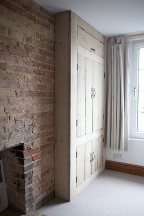 lovely built in rustic wardrobe made from reclaimed wood. And I love bricks like this in an interior! -   23 rustic fitness wardrobes
 ideas