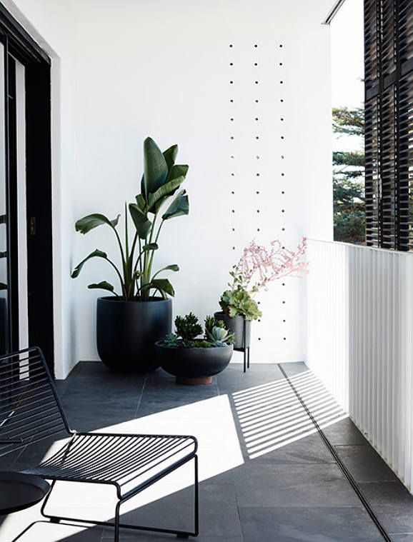 Collection of black planters // modern patio design // black and white exterior -   24 simple balcony decor
 ideas