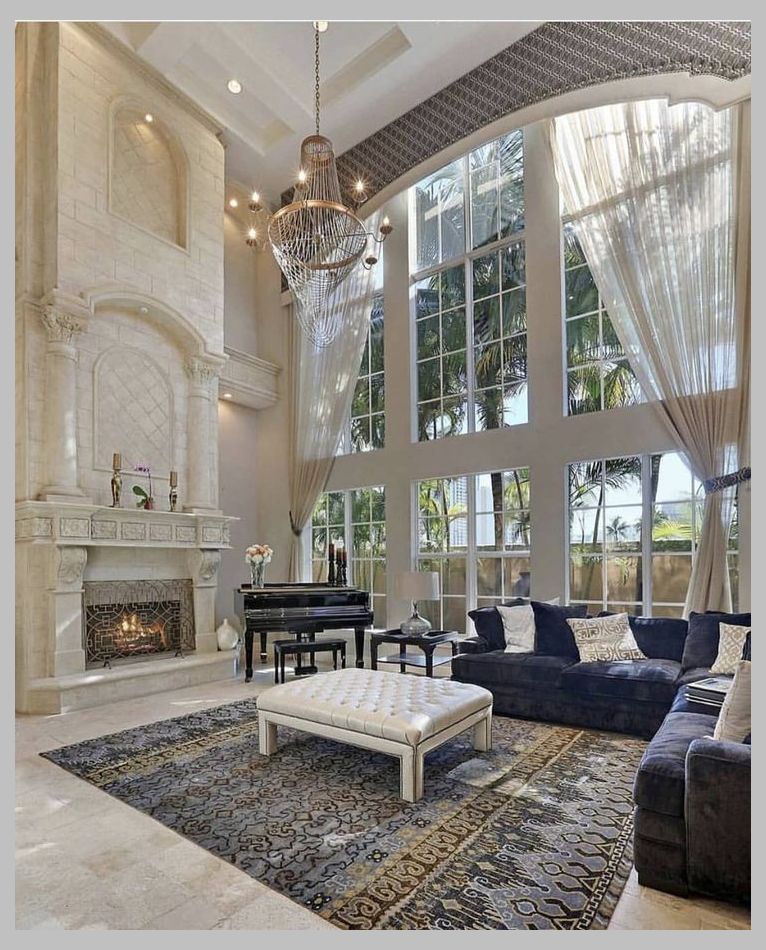 Beautiful great room.  The tall ceilings/windows create such drama.  Fireplace at sitting hei... -   7 home accessories Luxury living rooms ideas