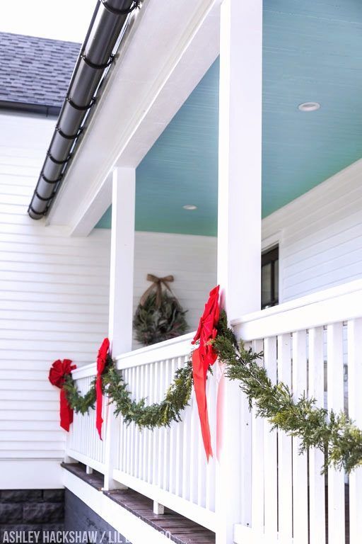 Farmhouse Porch Christmas Decor Ideas - Ashley Hackshaw / Lil Blue Boo -   18 christmas decor outdoor fence ideas