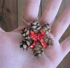 Mini Pine Cone Ornament Wreath with a Red Bow, Country Christmas Gift Topper, Natural Primitive Holiday Decor, Hemlock Hanging -   18 rustic tree topper pine cones ideas